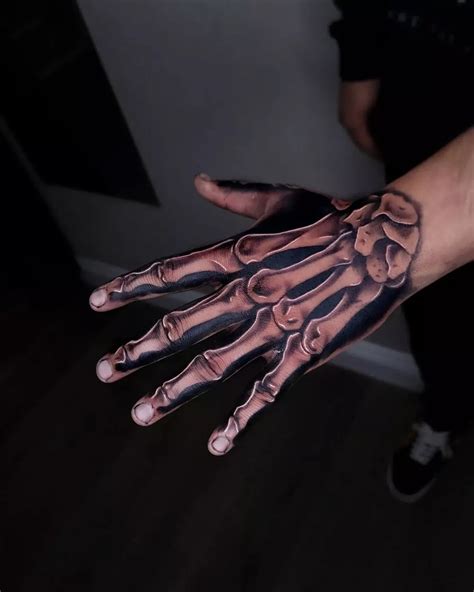 60 Skeleton Hand Tattoo Ideas And The Symbolism Behind Them