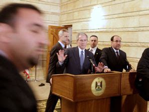 Bush Ducks Two Shoes Hurled By Iraqi Politico