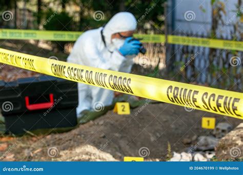 Crime Scene Investigation Forensic Science Specialist At Work Stock