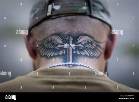 Cross With Wings Tattoo Back Of Neck At Sam Hamby Blog