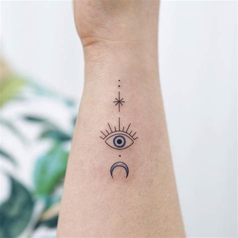 Evil Eye Tattoo Located On The Wrist Minimalistic