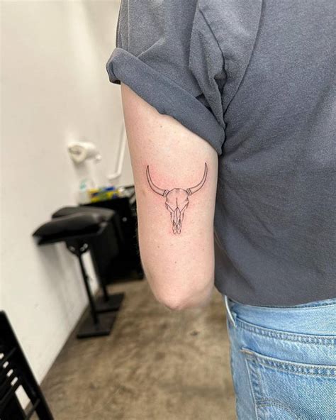 Fine Line Bull Skull Tattoo Located On The Tricep