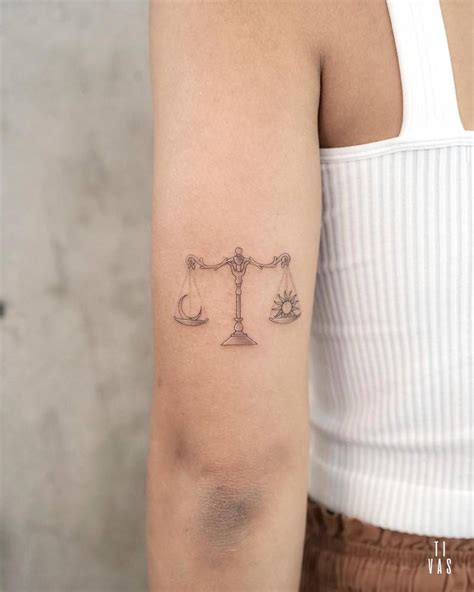 Libra Tattoo Located On The Tricep