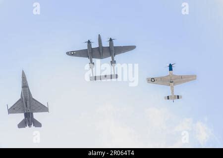 Martin F 16 And P 38 Lightning Flying Alongside A Boeing P 51 Mustang