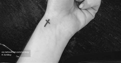 Minimalistic Style Cross Tattoo Placed On The Wrist