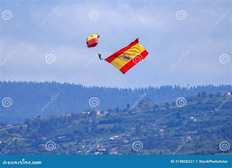 Paratrooper Descend With The Flag Of Spain On Armed Forces Day Stock