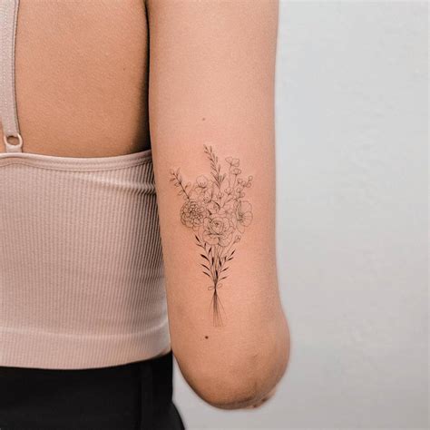Tattoo Of A Fine Line Flower Bouquet Located On The