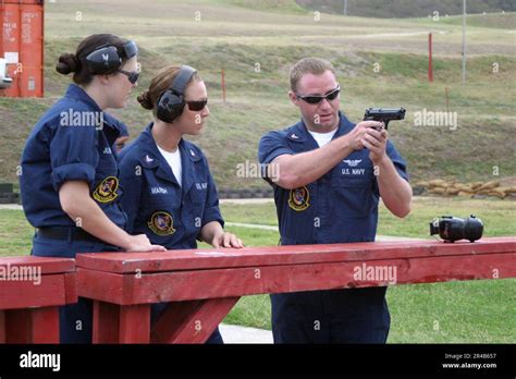 Us Navy Aviation Ordnanceman 3Rd Class Right Instructs Aviation