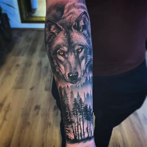 Wolf And Forest Tattoo On Forearm